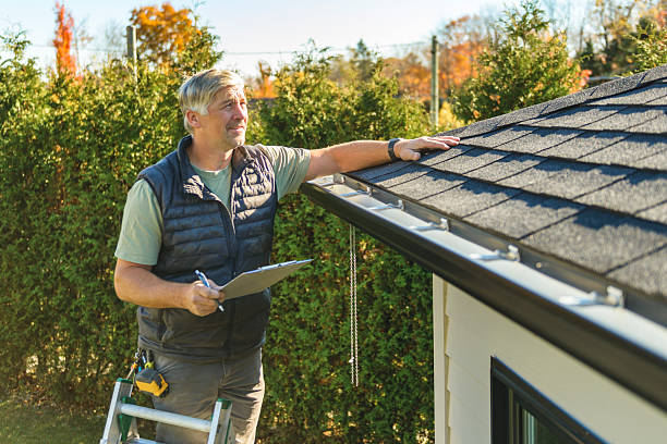 Professional Hail Damage Roof Repair technician working in May, ID